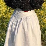 Vintage mládežnická minisukně s vysokým pasem, plisovaným potiskem a tulipánovým potiskem.