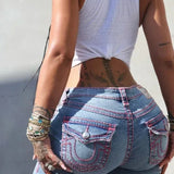 Vyšívané úzké černé džíny