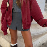 Volná kožená bunda ve vintage stylu s dlouhými rukávy a klopami