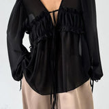 Bílá šifonová halenka s volánky a výstřihem do V s zavazováním